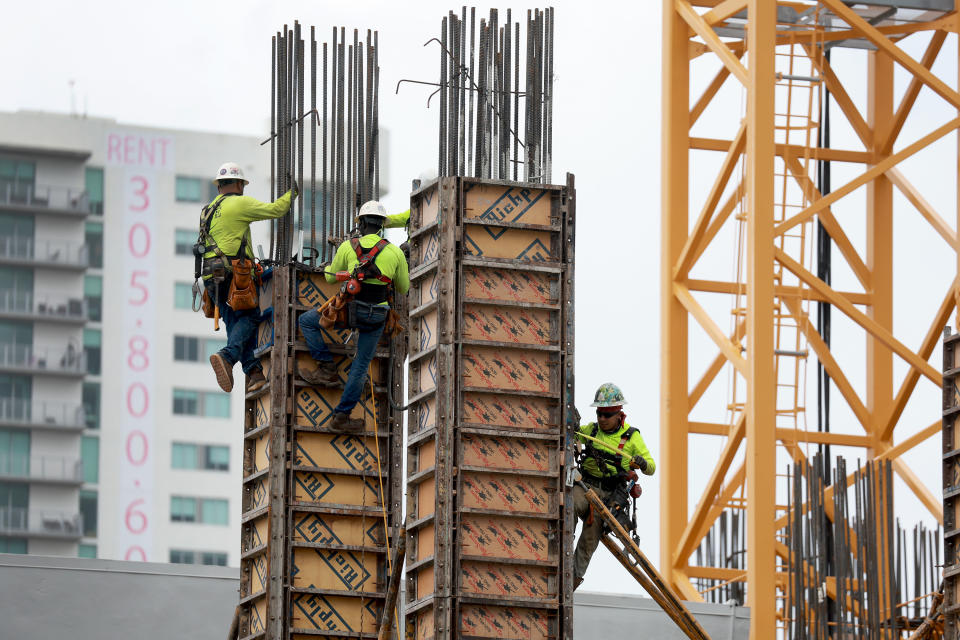 MIAMI, FLORIDA - OCTOBER 02: Construction workers build a residential high rise on October 02, 2023 in Miami, Florida.  According to the Census Bureau, apartment building starts fell to a seasonally adjusted annual rate of 334,000 units in August, marking a 41% decline from the pace seen the same month a year prior. (Photo by Joe Raedle/Getty Images)