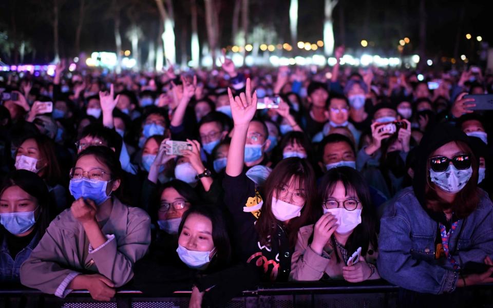 Packed crowds at a Beijing music festival this week show the extent to which China is returning to normal, in contrast to much of the rest of the world - NOEL CELIS/AFP