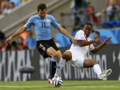 Costa Rica's Junior Diaz (R) fights for the ball with Uruguay's Christian Stuani during their 2014 World Cup Group D soccer match at the Castelao stadium in Fortaleza June 14, 2014. (Marcelo Delpozo/Reuters)