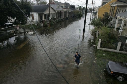 A man walks through a flooded neighborhood after Hurricane Katrina hit the area in 2005 in New Orleans, Louisiana. Google on Monday urged governments to get better at sharing information to allow citizens and first responders to make better use of the Internet during natural disasters