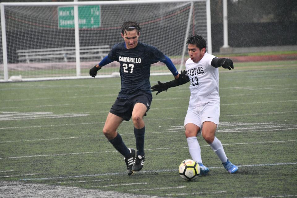 Camarillo's Owen Schoner (left) closes down Rio Mesa's Antonio Jimenez during the Scorpions' 1-0 win in the Buena High tournament on Dec. 29.