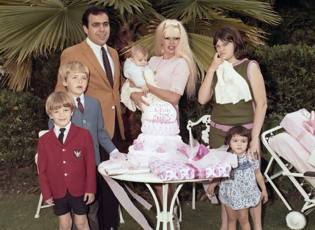 <p>UPI/Bettmann Archive/Getty</p> Jayne Mansfield celebrates her birthday with her family on set of 'Single Room, Furnished' in 1967.