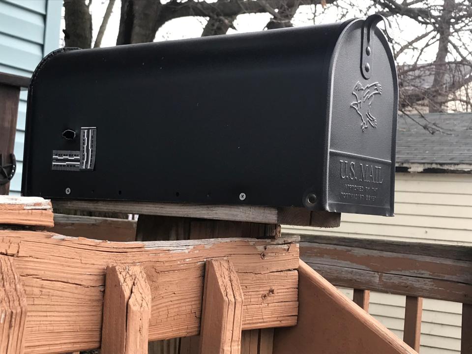 A bullet hole at the back of this mailbox is marked by police tape to show the scale of the hole. This was found at the scene of the Nov. 25, 2022, killing of Terry Robinson, 52, 2022.