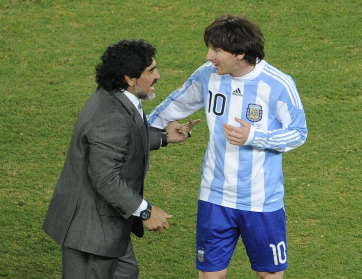 Argentina's striker Lionel Messi (R) is congratulated by Argentina's coach Diego Maradona at the end of the 2010 World Cup round of 16 football match Argentina vs. Mexico on June 27, 2010 at Soccer City stadium in Soweto, suburban Johannesburg. Argentina defeated Mexico 3-1.NO PUSH TO MOBILE / MOBILE USE SOLELY WITHIN EDITORIAL ARTICLE  -      AFP PHOTO / JAVIER SORIANO (Photo credit should read JAVIER SORIANO/AFP via Getty Images)