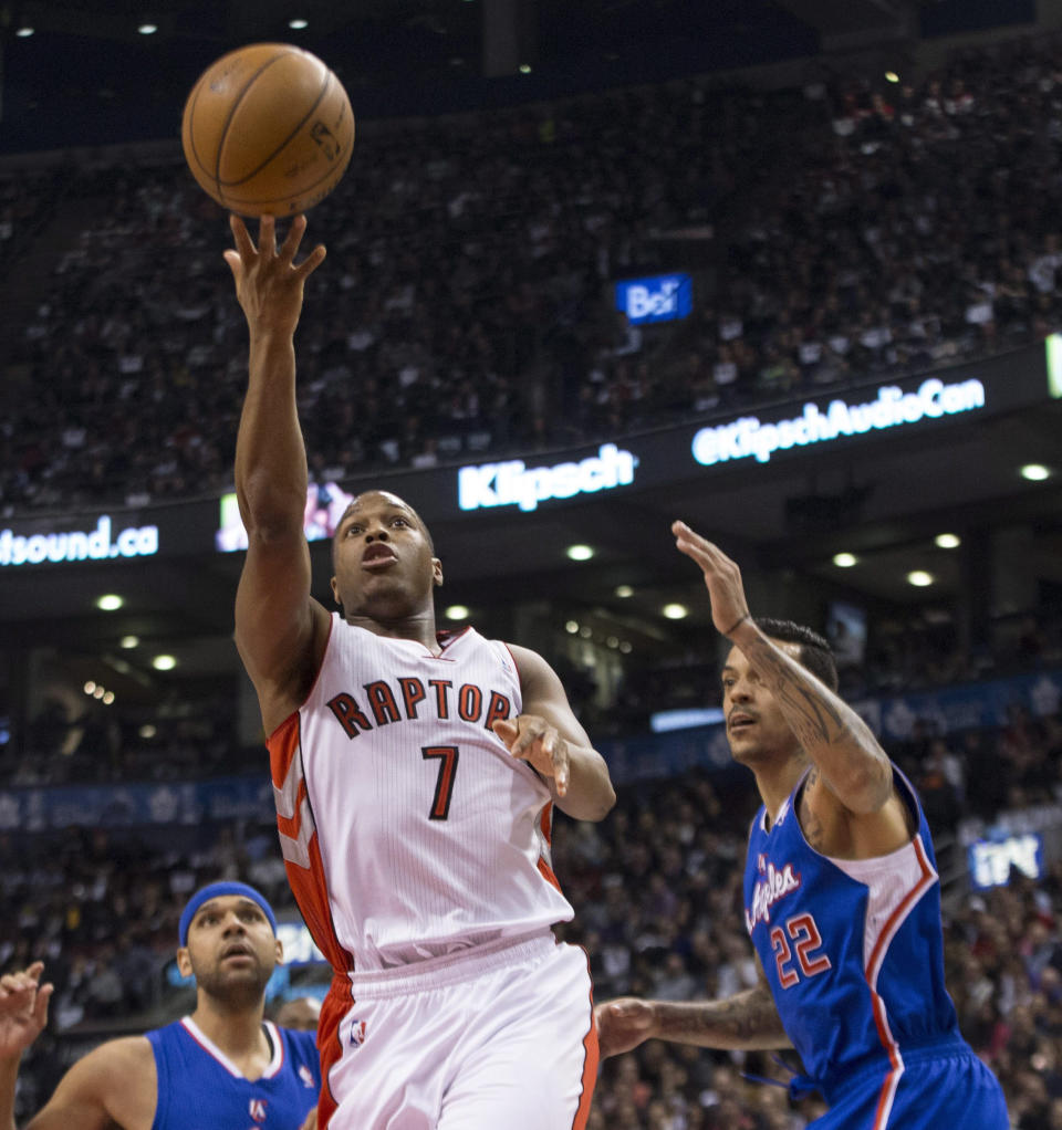 Toronto Raptors' Kyle Lowry drives through the Los Angeles Clippers defense to shoot during the first half of an NBA basketball game, Saturday, Jan. 25, 2014 in Toronto. (AP Photo/The Canadian Press, Chris Young)