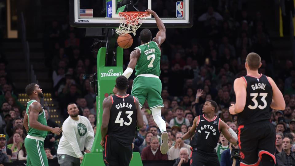 Oct 25, 2019; Boston, MA, USA; Boston Celtics guard Jaylen Brown (7) dunks the ball past Toronto Raptors forward Pascal Siakam (43) during the first half at TD Garden. Mandatory Credit: Bob DeChiara-USA TODAY Sports