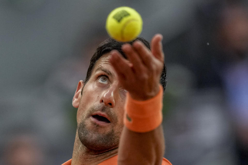 Serbia's Novak Djokovic servers against Gael Monfils, of France, during their match at the Mutua Madrid Open tennis tournament in Madrid, Spain, Tuesday, May 3, 2022. (AP Photo/Manu Fernandez)