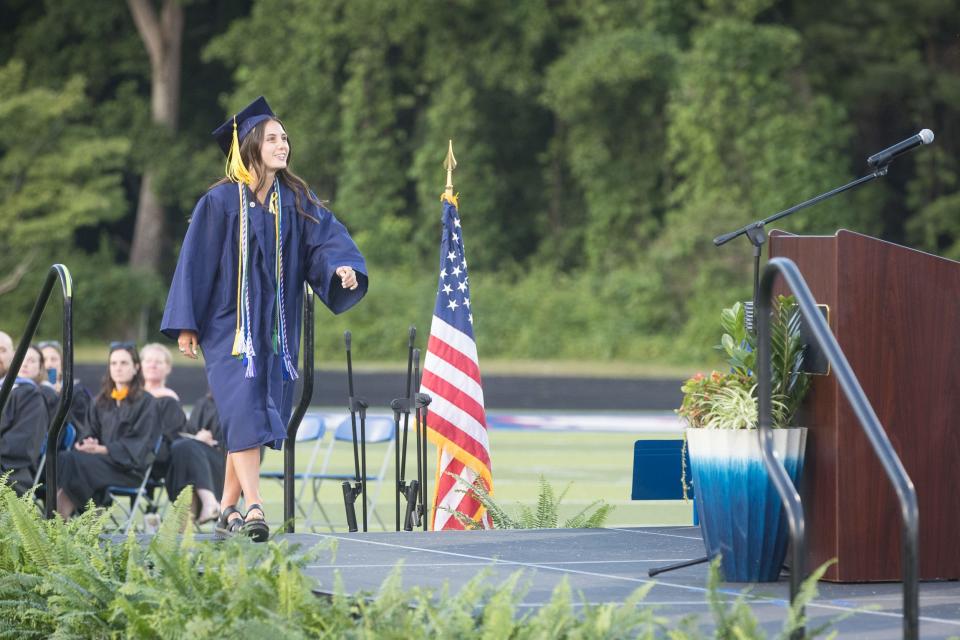 Jesse Jakubielsk walks on stage to accept a scholarship from Pepsi at West Henderson High School Commencement Ceremony on Friday. [PAT SHRADER/ SPECIAL TO THE TIMES-NEWS]