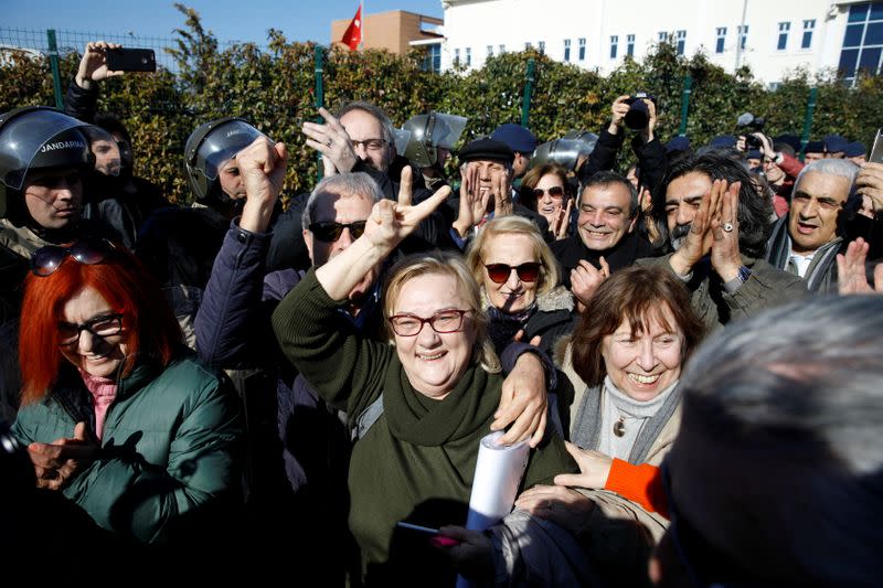 Mucella Yapici flashes V sign after leaving courtroom at Silivri Prison and Courthouse complex in Silivri