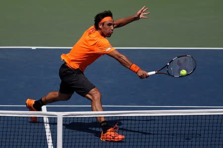 Sep 4, 2016; New York, NY, USA; Marcos Baghdatis of Cyprus hits a volley against Gael Monfils of France (not pictured) on day seven of the 2016 U.S. Open tennis tournament at USTA Billie Jean King National Tennis Center. Monfils won 6-3, 6-2, 6-3. Mandatory Credit: Geoff Burke-USA TODAY Sports