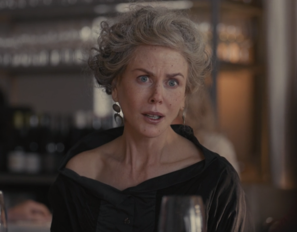 Nicole Kidman wearing a flimsy gray wig