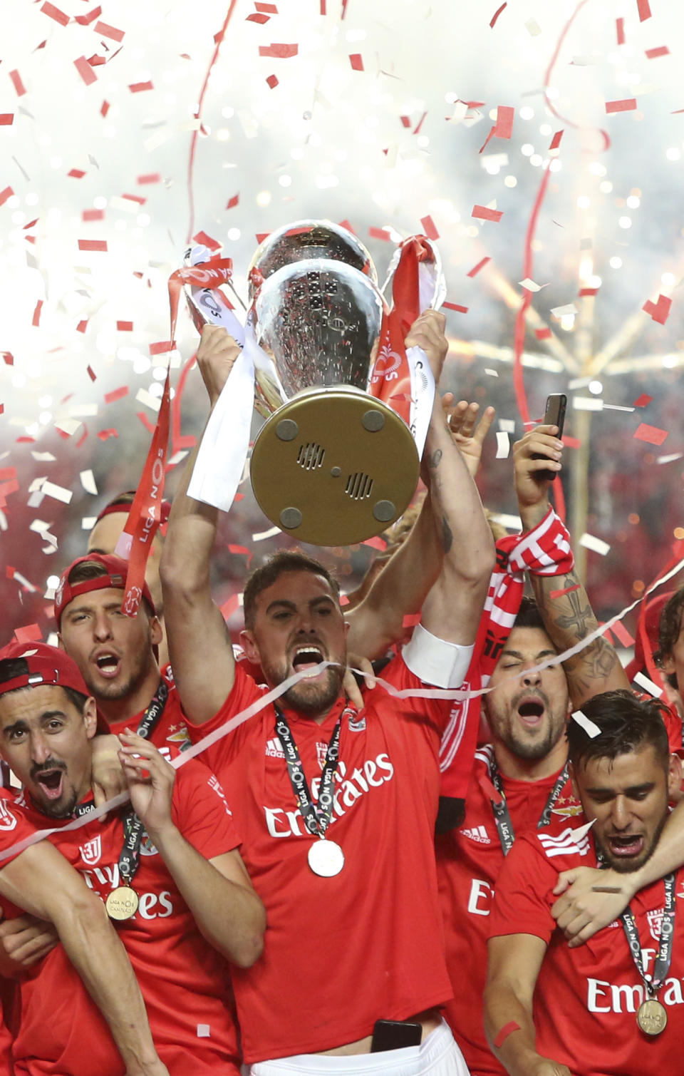 Benfica's team captain Jardel lifts the trophy after the Portuguese league last round soccer match between Benfica and Santa Clara at the Luz stadium in Lisbon, Saturday, May 18, 2019. Benfica won 4-1 to clinch the championship title. (AP Photo/Armando Franca)