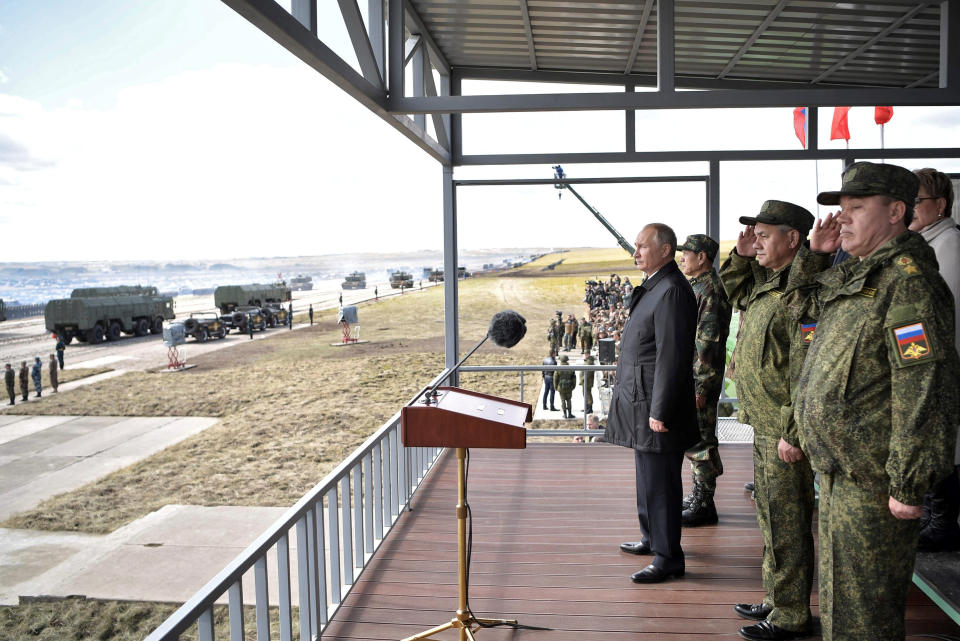 Russian President Vladimir Putin, Chinese Defense Minister Wei Fenghe, Defense Minister Sergei Shoigu and Chief of the General Staff of Russian Armed Forces Valery Gerasimov watch a military parade during the Vostok-2018 war games in Russia.