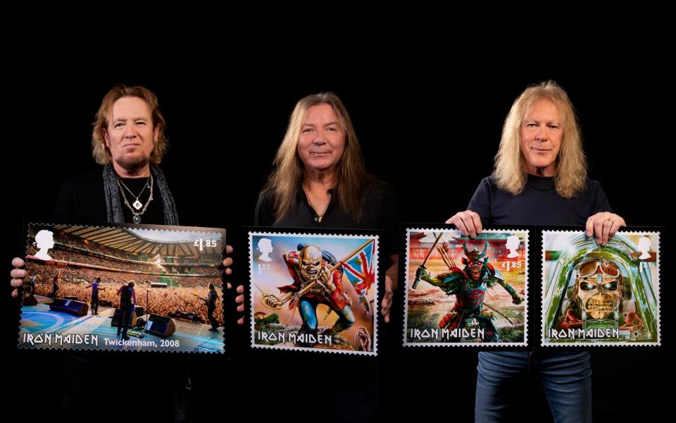 Iron Maiden showing off their stamp collection - John McMurtrie