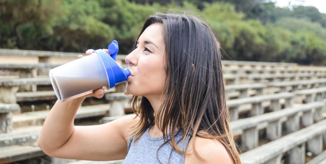 meal replacement shakes, woman drinking a meal replacement shake
