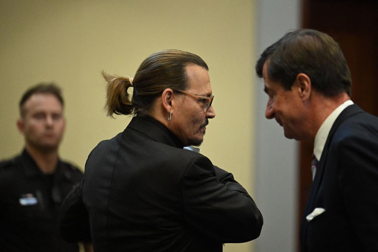 U.S. actor Johnny Depp attends his defamation trial at the Fairfax County Circuit Courthouse in Fairfax, Virginia on April 19, 2022. Depp is suing ex-wife Amber Heard for libel after she wrote an op-ed piece in The Washington Post in 2018 referring to herself as a public figure representing domestic abuse.