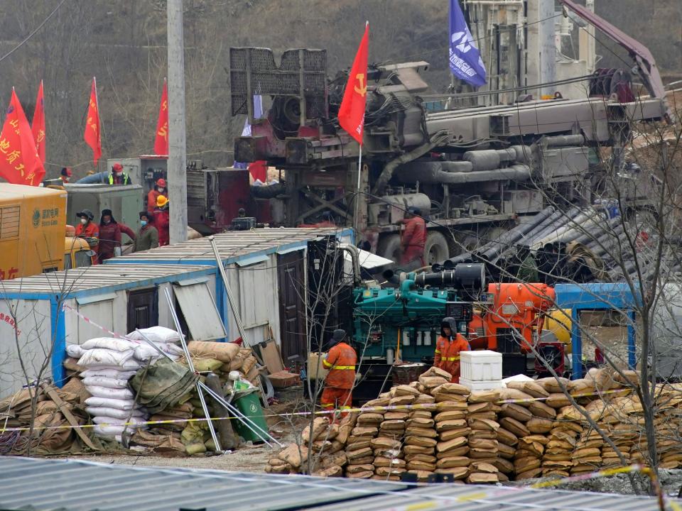 Rescuers work at the Hushan gold mine where workers were trapped underground after the Jauary 10 explosion, in Qixia, Shandong province (REUTERS)