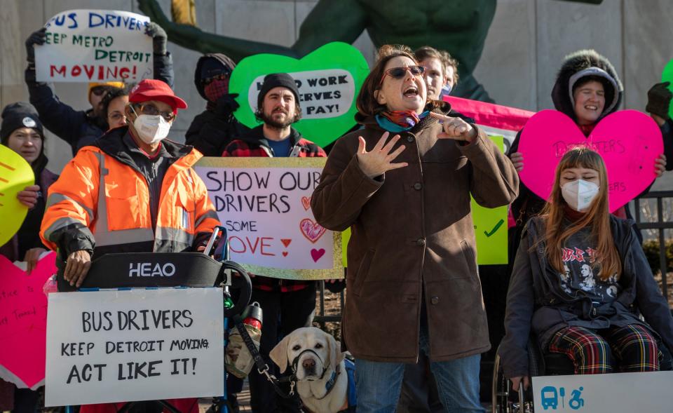 Megan Owens, executive director of Transportation Riders United, also known as TRU, speaks during a rally for better bus service in front of the Spirit of Detroit statue outside the Coleman A. Young Municipal Center in Detroit on Feb. 14, 2023.