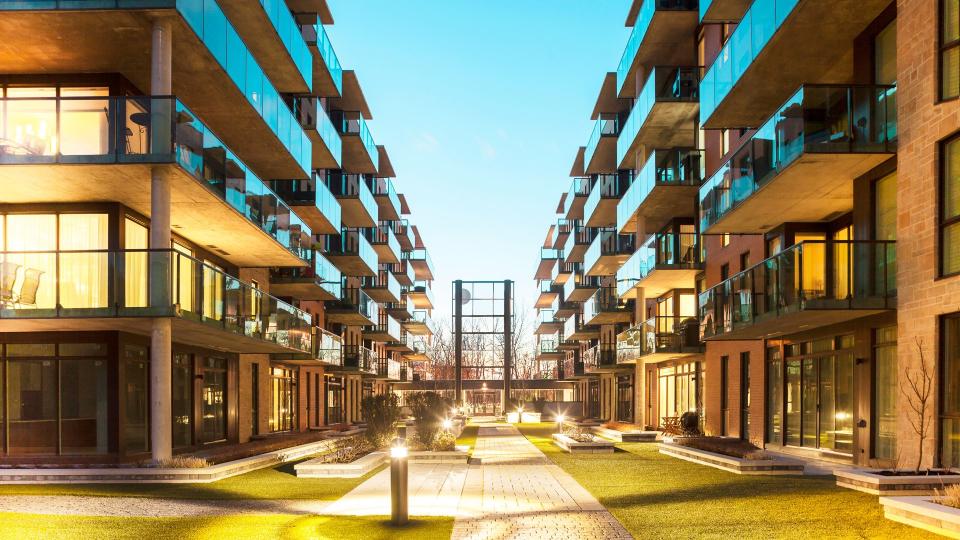 Balconies of a modern luxury apartments with a blue sky.