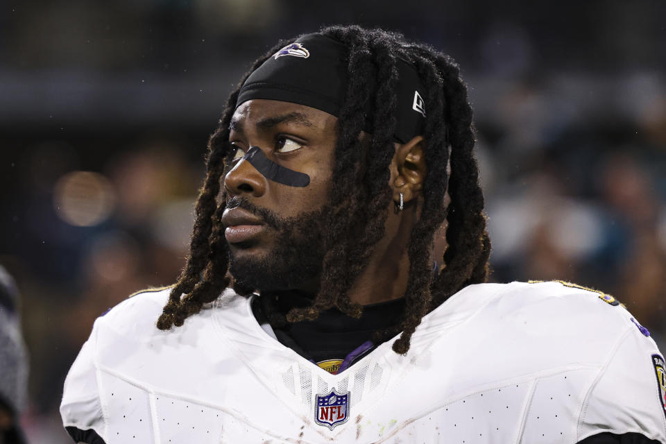 JACKSONVILLE, FL - DECEMBER 17: Gus Edwards #35 of the Baltimore Ravens looks on from the sideline during the national anthem prior to an NFL football game against the Jacksonville Jaguars at EverBank Stadium on December 17, 2023 in Jacksonville, Florida. (Photo by Perry Knotts/Getty Images)