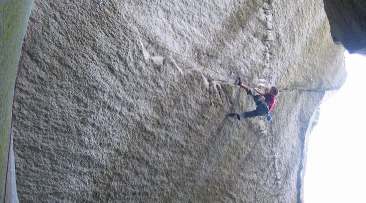 "Chris Sharma working Dreamcatcher, before he sent it several weeks later, in July 2005 during the Petzl RocTrip, Squamish, BC. Photo by Luke Laeser"