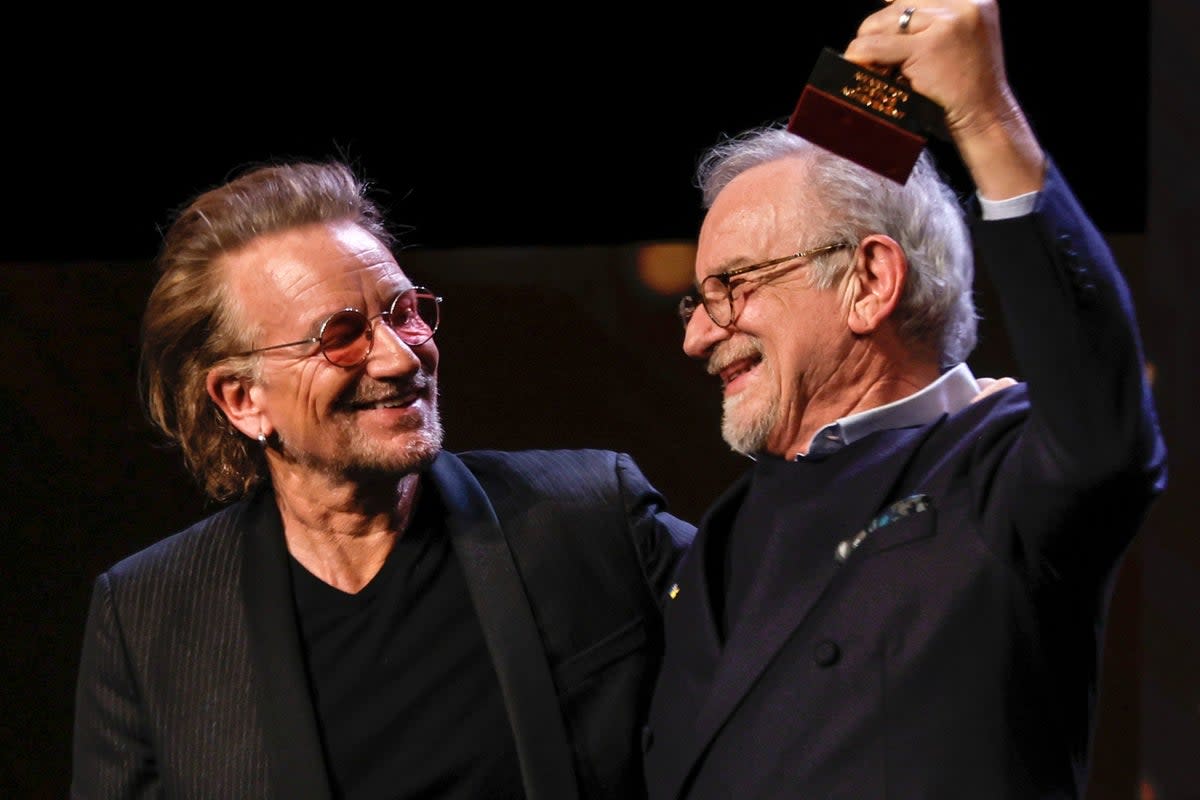 Bono made a surprise appearance at the film festival to present Spielberg with the Golden Bear award  (AP)