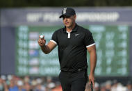 Brooks Koepka reacts after putting on the 13th green during the third round of the PGA Championship golf tournament, Saturday, May 18, 2019, at Bethpage Black in Farmingdale, N.Y. (AP Photo/Julio Cortez)