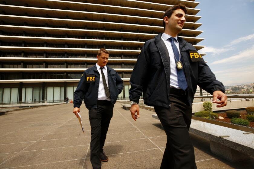 LOS ANGELES CA JULY 22, 2019 -- FBI agents leave the downtown headquarters of the Los Angeles Department of Water and Power after serving a search warrant Monday, July 22, 2019. Authorities have declined to discuss the nature of the investigation. (Al Seib / Los Angeles Times)