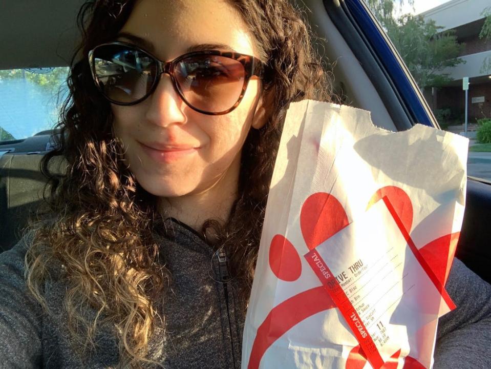 The write holding the Chick-Fil-A bag