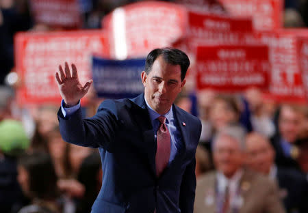 FILE PHOTO: Wisconsin Governor Scott Walker waves after speaking during the third day of the Republican National Convention in Cleveland, Ohio, U.S., July 20, 2016. REUTERS/Carlo Allegri/File Photo