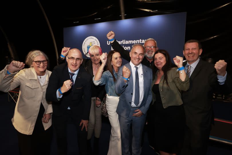 Alex Easton, Independent Unionist candidate, celebrates with supporters after he is declared the winner for the North Down constituency