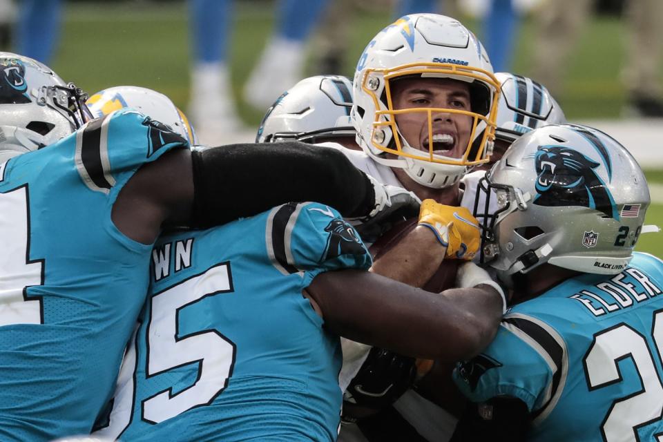 Chargers tight end Hunter Henry makes a catch between a group of Panthers defenders on the last drive of the game.