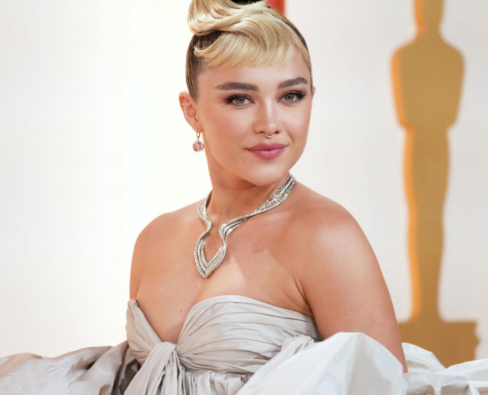 Actress Florence Pugh wore a Tiffany & Co. necklace in platinum with diamonds, earrings in platinum with pink tourmalines and diamonds, and two Tiffany Soleste rings to the Oscars. (Photo by Kevin Mazur/Getty Images)