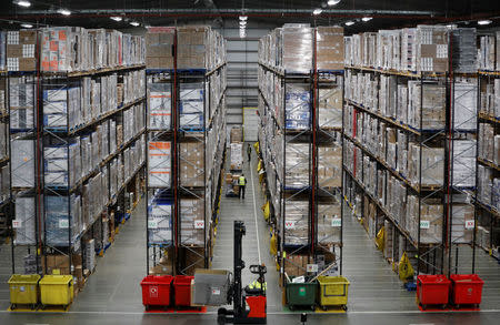 Workers pick orders at the PC World and Carphone Warehouse distribution centre in Newark, Britain November 21, 2017. REUTERS/Darren Staples