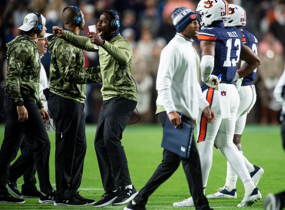 Auburn Tigers interim head coach Carnell "Cadillac" Williams talks with his team during a break in the action as Auburn Tigers take on Texas A&M Aggies at Jordan-Hare Stadium in Auburn, Ala., on Saturday, Nov. 12, 2022. Auburn Tigers lead Texas A&M 7-0 at halftime.