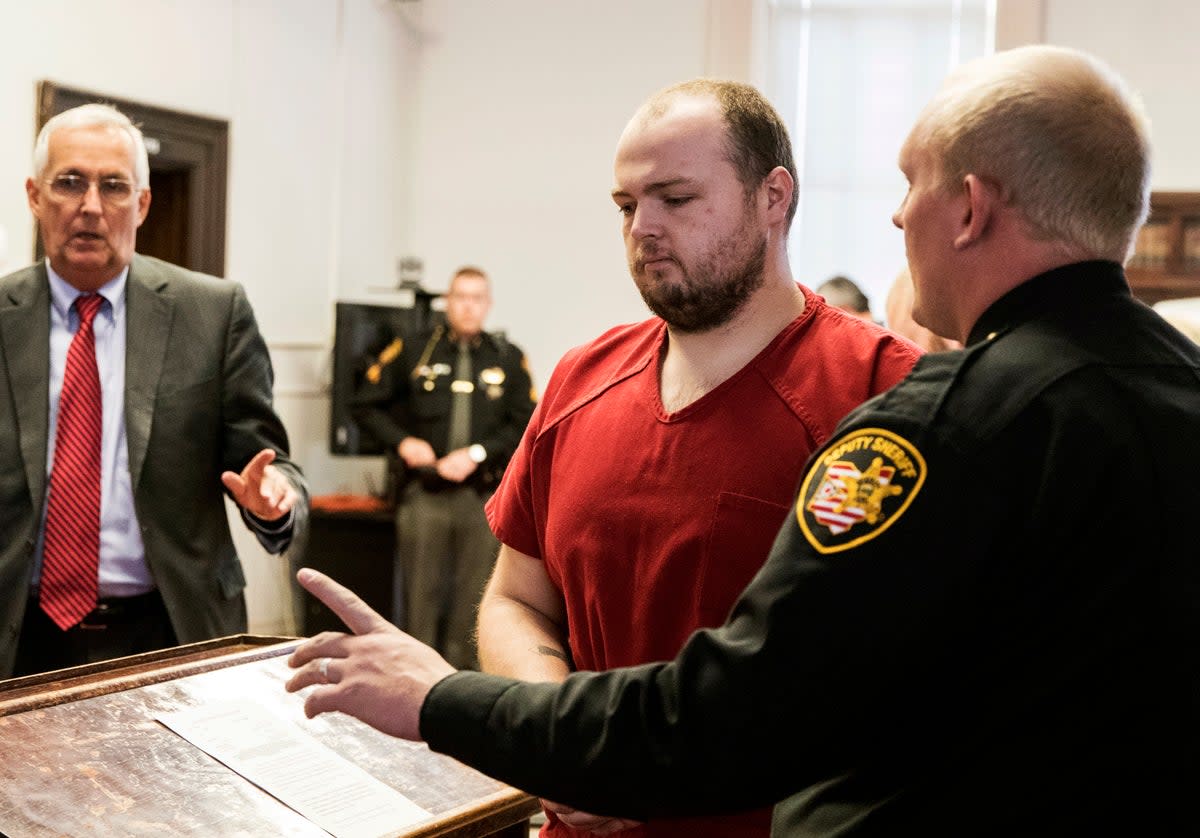 George Wagner IV is escorted out of the courtroom after his arraignment in November 2018, at the Pike County Courthouse, in Waverly, Ohio (Â© Robert McGraw/Chillicothe Gazette - 2018)