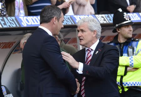 Britain Soccer Football - Swansea City v Stoke City - Premier League - Liberty Stadium - 22/4/17 Swansea City manager Paul Clement shakes hands with Stoke City manager Mark Hughes before the match Reuters / Rebecca Naden Livepic