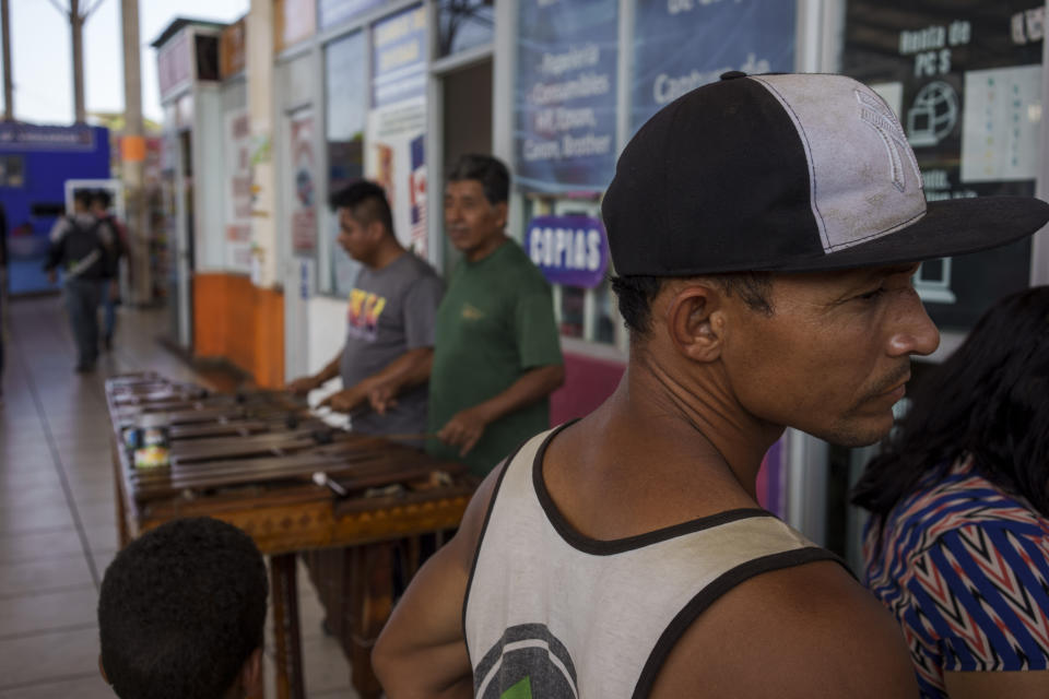 Migrants gather at a bus station after crossing the border between Mexico and Guatemala, in Tapachula, Mexico, Thursday, Jan. 19, 2023. Jose Mateo Martinez, Chiapas state prosecutor for migrant affairs, says El Salvador's crackdown on organized crime is behind the increase in criminal activity in Mexico. (AP Photo/Moises Castillo)