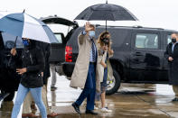 Democratic presidential candidate former Vice President Joe Biden, accompanied by his granddaughter Natalie Biden, right, boards his campaign plane at New Castle Airport in New Castle, Del., Thursday, Oct. 29, 2020, to travel to Florida for drive-in rallies. (AP Photo/Andrew Harnik)