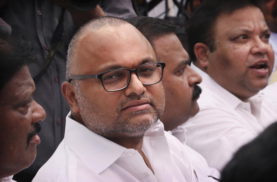 Karti Chidambaram, son of former Indian Finance Minister Palaniappan Chidambaram, participates in an an all party protest against the revocation of Kashmir's special constitutional status from Indian state of Jammu and Kashmir, in New Delhi, India, Thursday, Aug. 22, 2019. Karti Chidambaram has already been named as a defendant in the money-laundering case involving 3 billion rupees ($43 million). His father Palaniappan Chidambaram has already been arrested in the case. (AP Photo/Manish Swarup)
