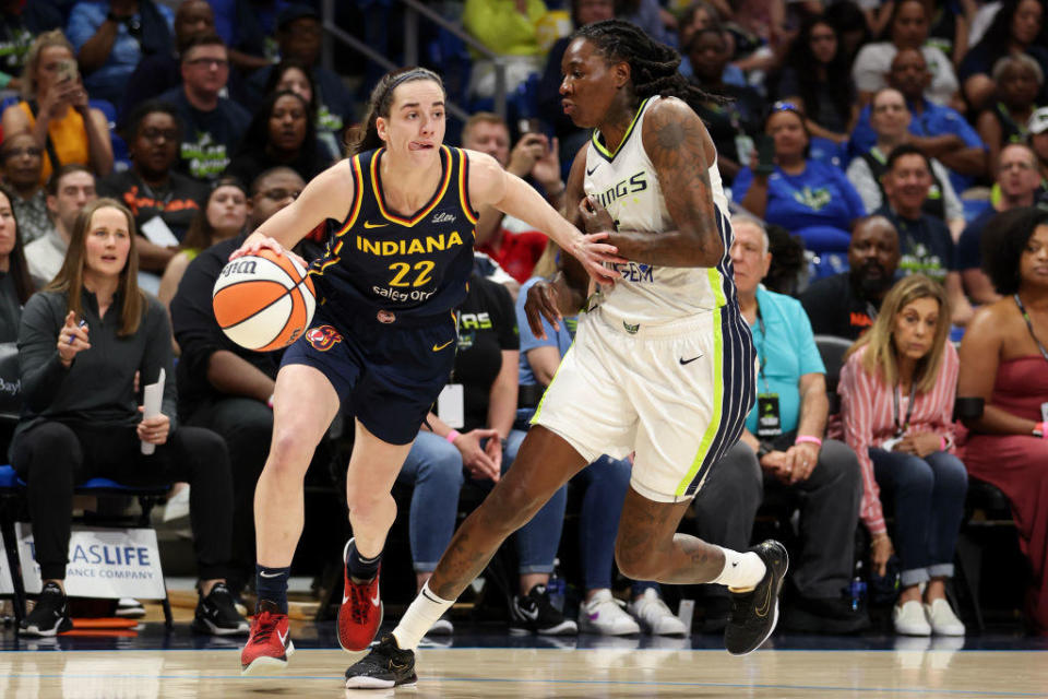Caitlin Clark of the Indiana Fever drives to the basket against the Dallas Wings during the first quarter of a WNBA preseason game at College Park Center on May 3, 2024, in Arlington, Texas. / Credit: Getty Images