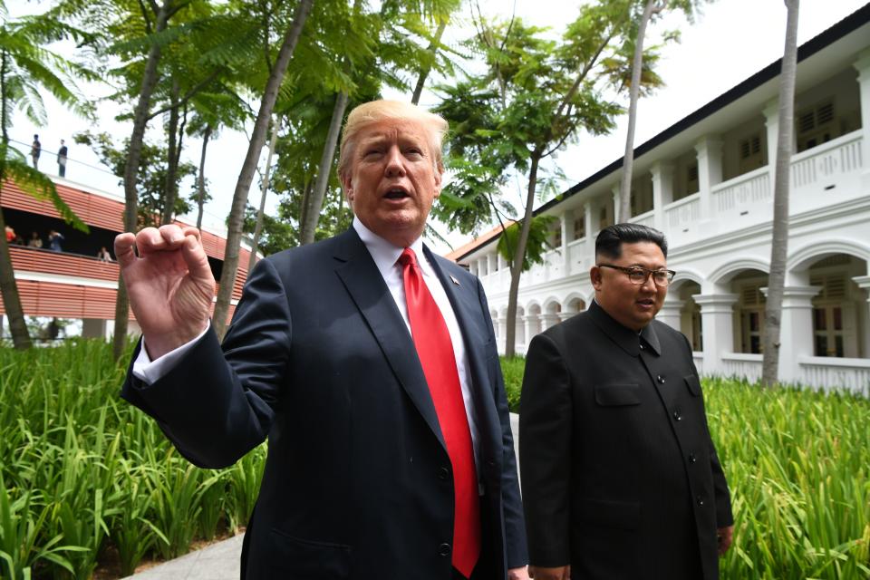 Donald Trump and North Korea's Kim Jong Un on June 12. (Photo: ANTHONY WALLACE via Getty Images)