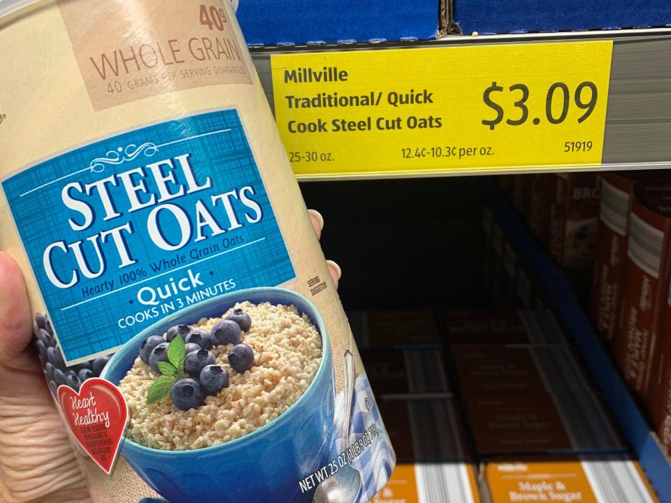 hand holding package of steel cut oats at aldi
