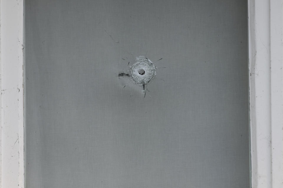 A bullet impact is seen in the windows of Saudi Arabia's embassy in The Hague, Netherlands, Thursday, Nov. 12, 2020, after several shot were fired at the building early in the morning. Nobody was injured and police were investigating. (AP Photo/Mike Corder)