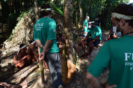 Members of the Brazil's indigenous affairs agency FUNAI contact a group of Korubo Indigenous people in the Javari Valley reservation, Brazil October 30, 2015. FUNAI/Handout via Reuters