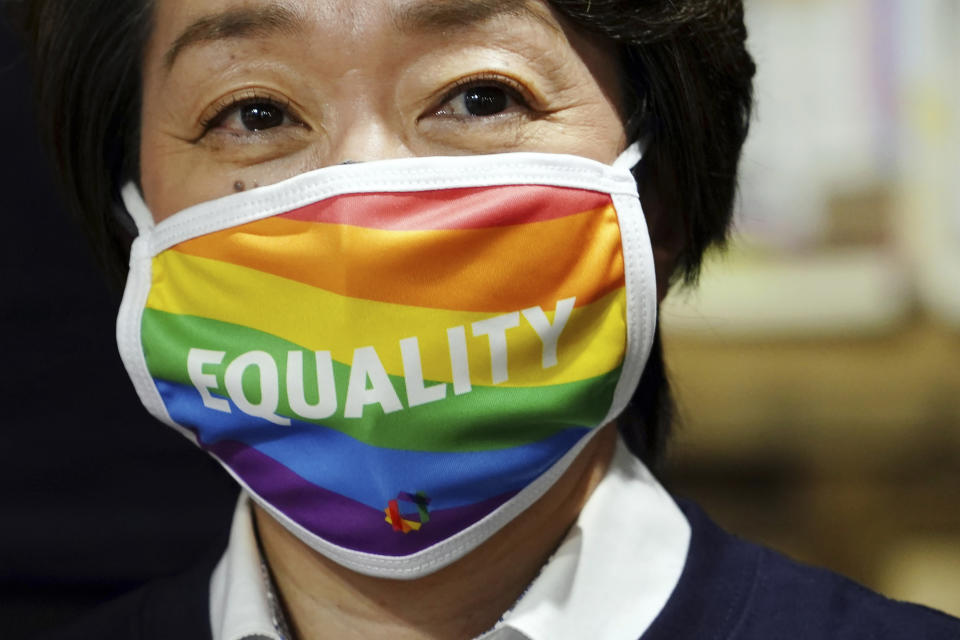 Tokyo 2020 Organizing Committee President Seiko Hashimoto wearing a rainbow-colored mask with word "Equality" visits Pride House Tokyo Legacy in Tokyo Tuesday, April 27, 2021. Japan marked LGBTQ week with pledge to push for equality law before the Olympics. (AP Photo/Eugene Hoshiko, Pool)