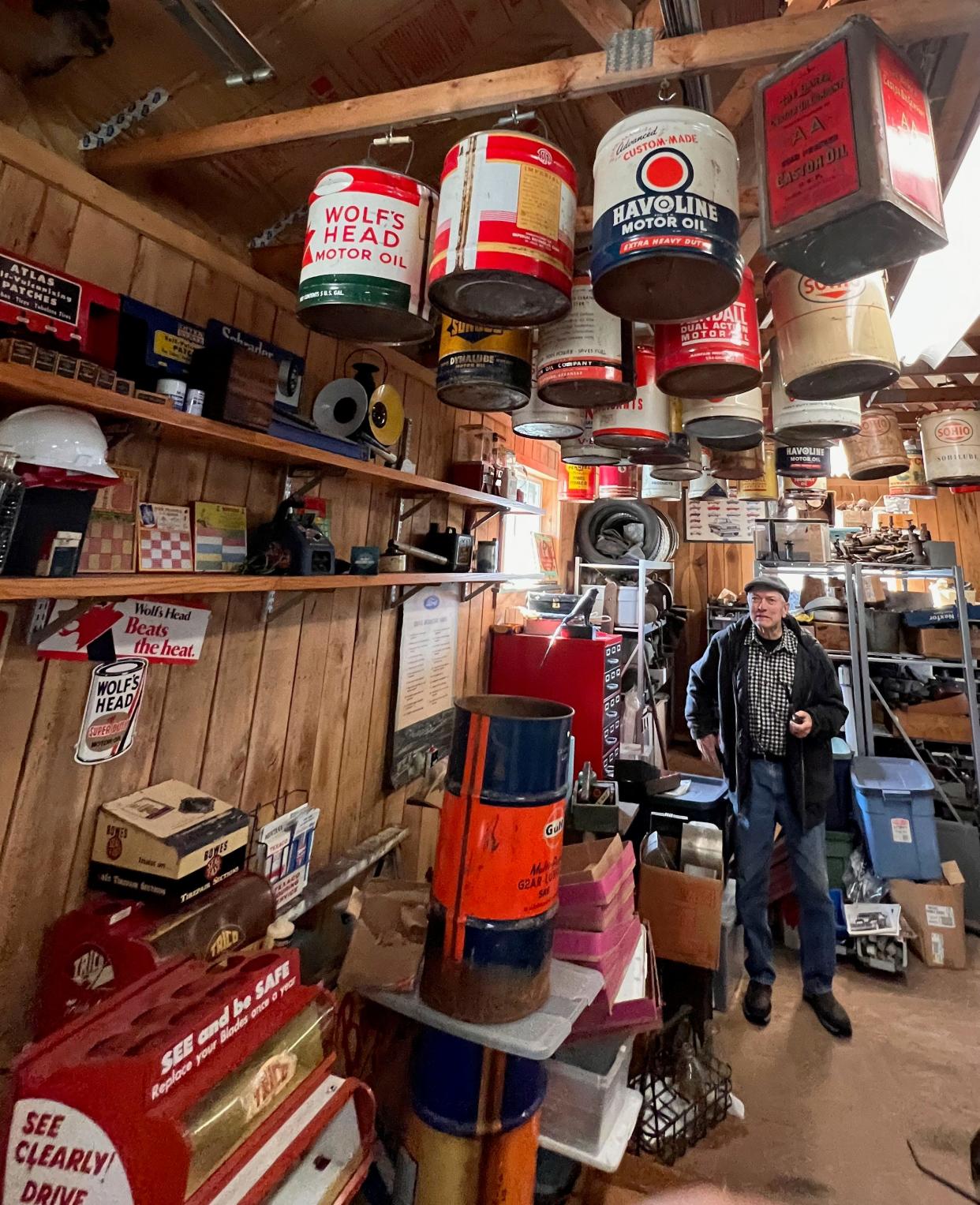 Chuck Bowman has a collection of gas cans, license plates, signs, memorobilia and classic cars and tractors.