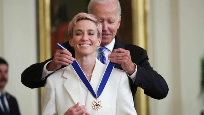 President Joe Biden presents the Presidential Medal of Freedom to soccer player and advocate for gender pay equality Megan Rapinoe during a ceremony in the East Room of the White House. (Photo: Alex Wong/Getty Images)