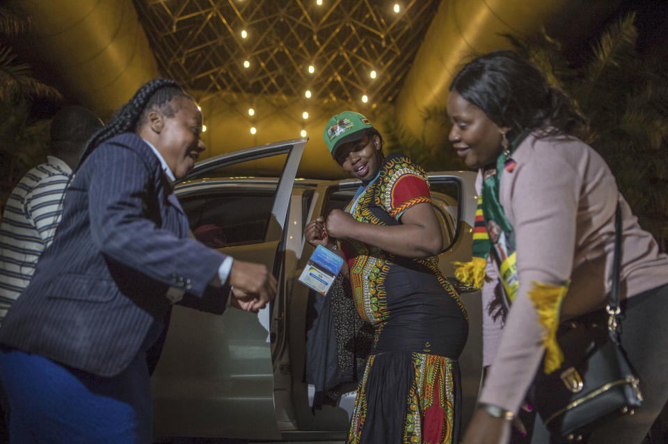 ZANU-PF supporters celebrate the victory of Zimbabwean President Emmerson Mnangagwa at the conference center where the results were announced in Harare, Zimbabwe, Friday Aug. 3, 2018. Mnangagwa won election Friday with just over 50 percent of the ballots as the ruling party maintained control of the government in the first vote since the fall of longtime leader Robert Mugabe. (AP Photo/Mujahid Safodien)