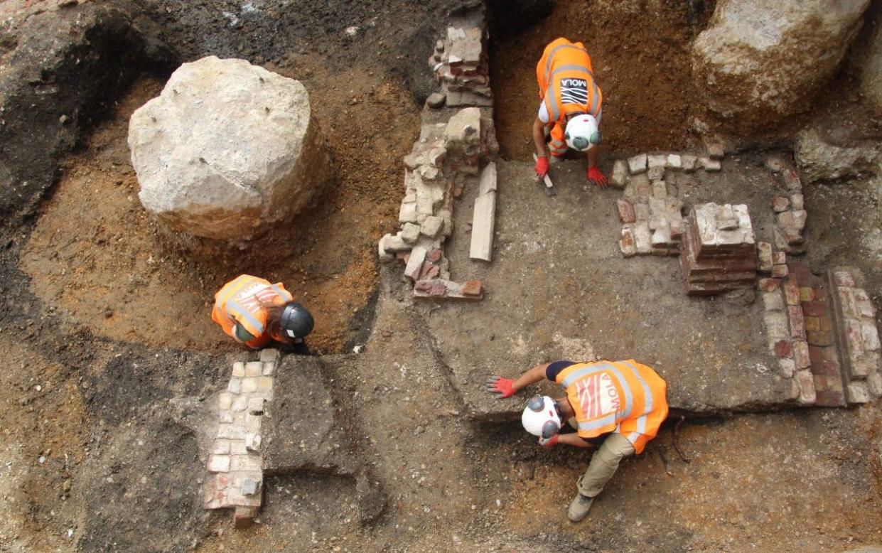 Archaeologists excavate the remains of building foundations at Holborn Viaduct